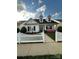 Charming single-Gathering home with a manicured lawn, a white picket fence and inviting front porch at 1103 Phar Lap Dr, Indian Trail, NC 28079