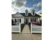 Charming single-Gathering home with a manicured lawn, a white picket fence and inviting front porch at 1103 Phar Lap Dr, Indian Trail, NC 28079