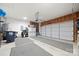 Spacious two car garage with overhead door, storage space, and ample room for vehicles at 1103 Phar Lap Dr, Indian Trail, NC 28079