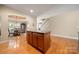 Open floor plan showing a kitchen island with granite countertop and view into the dining room at 1103 Phar Lap Dr, Indian Trail, NC 28079