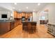 Open kitchen design with stainless appliances, granite countertops, and central island; great for food preparation and gatherings at 1103 Phar Lap Dr, Indian Trail, NC 28079