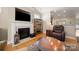 A cozy living room featuring a fireplace with mantle, and views to other rooms at 1103 Phar Lap Dr, Indian Trail, NC 28079