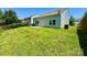 Expansive backyard featuring a lush green lawn, providing ample space for outdoor activities and relaxation at 11109 Pond Valley Ct, Charlotte, NC 28269
