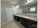 Bright bathroom with double sinks and views of the soaking tub and shower at 11109 Pond Valley Ct, Charlotte, NC 28269