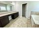 Bathroom with a large vanity, neutral walls, and tile flooring at 11109 Pond Valley Ct, Charlotte, NC 28269
