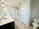 A full bathroom featuring a double sink vanity, toilet, and shower-tub combo at 11109 Pond Valley Ct, Charlotte, NC 28269