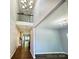 Spacious entryway featuring high ceilings, hardwood floors, and staircase at 11109 Pond Valley Ct, Charlotte, NC 28269