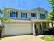 Desirable home with a two-car garage, a welcoming front porch, and green landscaping near the front entrance at 11109 Pond Valley Ct, Charlotte, NC 28269