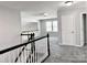 Spacious hallway with gray carpet and neutral walls, leading to several rooms and a bonus room at 11109 Pond Valley Ct, Charlotte, NC 28269