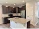 Kitchen with granite countertops, stainless steel appliances, and ample cabinet space at 11109 Pond Valley Ct, Charlotte, NC 28269