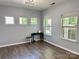 Well-lit living room with modern chandelier and views of the exterior at 11109 Pond Valley Ct, Charlotte, NC 28269