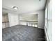 A carpeted loft area overlooking the foyer with white walls and a black railing at 11109 Pond Valley Ct, Charlotte, NC 28269