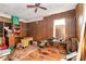 Untidy bedroom with wood paneling, cluttered with furniture and various household items at 112 Harmony Trl, Gastonia, NC 28056