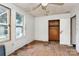 This bedroom features light walls, two windows, wood floors, and closet at 112 Harmony Trl, Gastonia, NC 28056