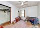 Untidy bedroom with wood floors, featuring furniture and an open closet at 112 Harmony Trl, Gastonia, NC 28056