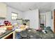 Dilapidated kitchen featuring old appliances and flooring at 112 Harmony Trl, Gastonia, NC 28056