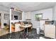 Dilapidated kitchen featuring old appliances and cabinetry at 112 Harmony Trl, Gastonia, NC 28056