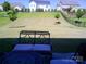 View of backyard with wrought iron patio furniture and a view of fenced yard at 1141 Overlake Dr, Belmont, NC 28012