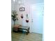 Entryway featuring a white front door, hardwood floors, bench, hat rack and coat rack at 1141 Overlake Dr, Belmont, NC 28012
