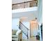 Bright entryway featuring a wooden staircase, hardwood floors, and white trim at 1141 Overlake Dr, Belmont, NC 28012