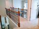 A charming hallway with elegant railings overlooking a cozy and inviting interior space at 1141 Overlake Dr, Belmont, NC 28012