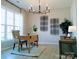 Bright home office space featuring a desk, neutral walls, and modern light fixture at 1141 Overlake Dr, Belmont, NC 28012