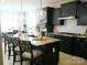 Modern kitchen with stainless steel appliances, granite countertops, and a kitchen island with seating at 1141 Overlake Dr, Belmont, NC 28012