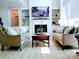 Cozy living room featuring a fireplace, built-in shelves, and two comfortable sofas at 1141 Overlake Dr, Belmont, NC 28012