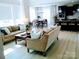 Spacious living room with hardwood floors and an open floor plan leading into the dining room at 1141 Overlake Dr, Belmont, NC 28012