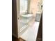 Modern bathroom with glass enclosed shower and a standalone soaking tub and marble flooring at 1237 Saint Johns Ave, Matthews, NC 28104