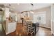 Open kitchen featuring granite countertops, stainless steel appliances, and a breakfast bar at 1237 Saint Johns Ave, Matthews, NC 28104