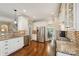 Bright kitchen with stainless steel appliances, granite countertops, and hardwood floors at 1237 Saint Johns Ave, Matthews, NC 28104