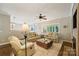Bright living room featuring neutral colors, hardwood floors, and comfortable seating arrangements at 1237 Saint Johns Ave, Matthews, NC 28104