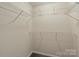 Walk-in closet has multiple levels of shelving providing lots of storage in a room with carpeting at 1556 Stanley Lucia Rd, Mount Holly, NC 28120
