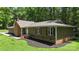 Charming single Gathering home exterior with a brick chimney and manicured landscaping at 1556 Stanley Lucia Rd, Mount Holly, NC 28120