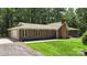 Charming single Gathering home exterior with a brick chimney, attached garage, and shutters at 1556 Stanley Lucia Rd, Mount Holly, NC 28120