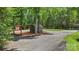 View of shed and containers used for storage on the property in wooded area at 1556 Stanley Lucia Rd, Mount Holly, NC 28120