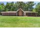 Attractive home featuring brick accents, shutters, a manicured lawn, and a welcoming entryway at 1556 Stanley Lucia Rd, Mount Holly, NC 28120