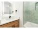 Chic bathroom featuring a vanity with a quartz countertop, modern fixtures, and a tiled shower with glass door at 177 Georgia Sw St, Concord, NC 28025