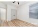 Bright bedroom featuring wood floors, ceiling fan, neutral walls, and closet at 177 Georgia Sw St, Concord, NC 28025