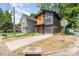 Contemporary home boasting a unique design with contrasting siding and a well-maintained front yard at 177 Georgia Sw St, Concord, NC 28025