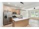 Bright kitchen featuring stainless appliances, a light wood island with white countertop, and hardwood floors at 177 Georgia Sw St, Concord, NC 28025