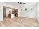 Stylish living room with hardwood floors, bright windows, and an open view of the adjacent kitchen area at 177 Georgia Sw St, Concord, NC 28025