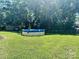 Spacious backyard featuring a round above ground pool, grassy lawn, and mature trees providing shade at 2174 Eastview Rd, Rock Hill, SC 29732