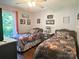 Charming bedroom features two twin beds with floral bedding and a bright window at 2174 Eastview Rd, Rock Hill, SC 29732