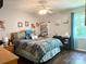 Comfortable bedroom with hardwood floors, a queen-sized bed, desk, and ample natural light at 2174 Eastview Rd, Rock Hill, SC 29732