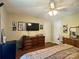 Cozy bedroom featuring hardwood floors, a large dresser, and a mounted TV for relaxing evenings at 2174 Eastview Rd, Rock Hill, SC 29732