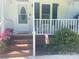 Close-up of the front porch area with brick steps and decorative plants at 2174 Eastview Rd, Rock Hill, SC 29732