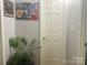 Well lit hallway features a potted plant and colorful artwork, creating a warm and inviting atmosphere at 2174 Eastview Rd, Rock Hill, SC 29732