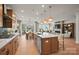 Gourmet kitchen with an island, stainless appliances, breakfast bar, and seamless flow into the dining and living areas at 2192 Millennium Dr # 91, Lancaster, SC 29720